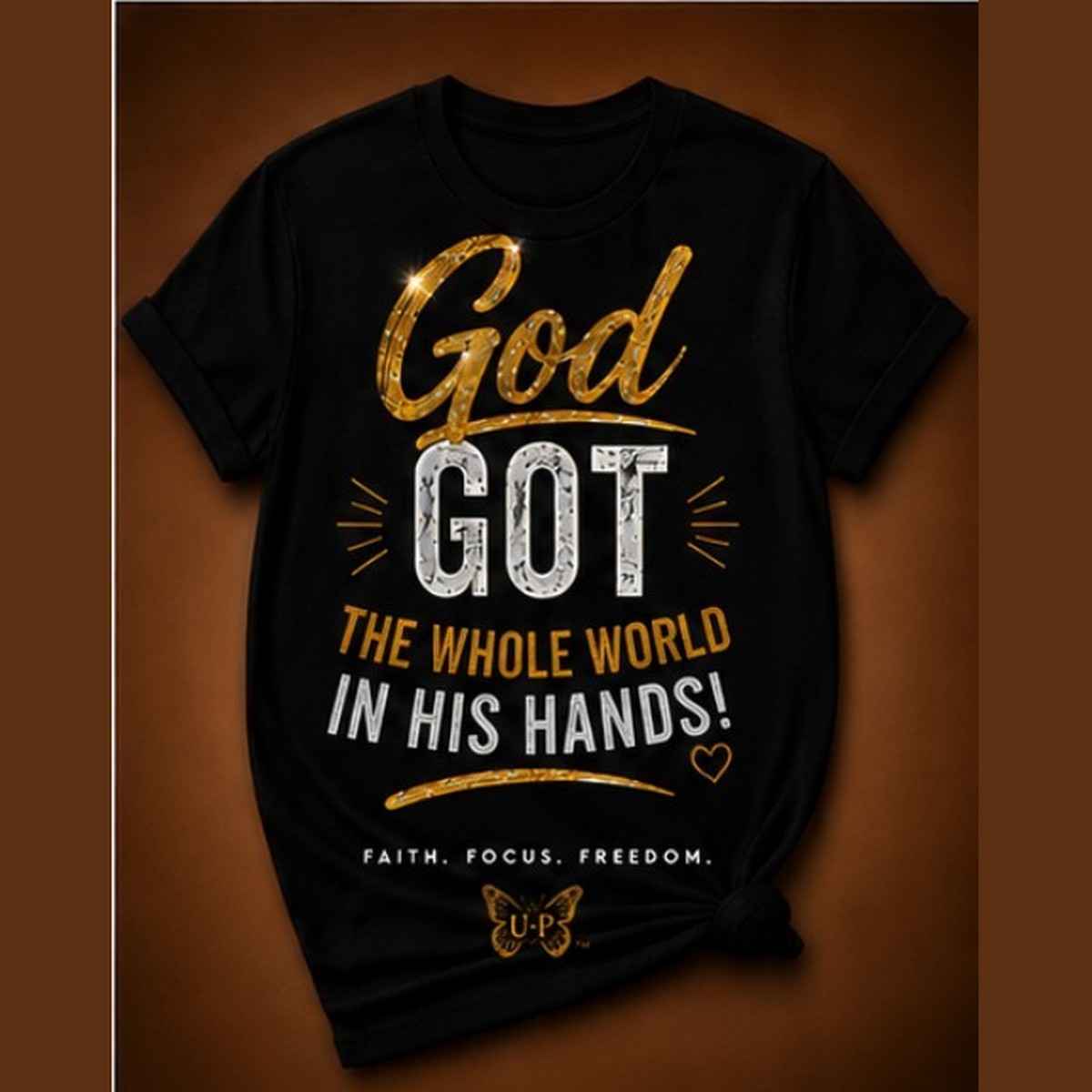 GOD GOT THE WHOLE WORLD IN HIS HANDS! design shown on black apparel